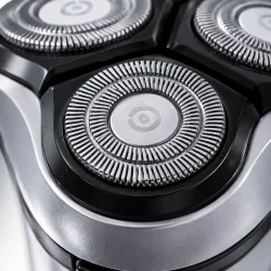Rotationsbarbermaskine med pr�cisionssk�r og fleksible barberhoveder